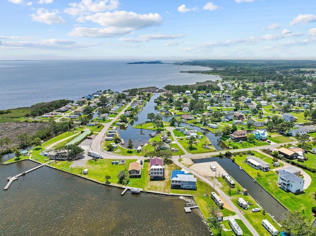 birds eye view of property with a water view and a residential view