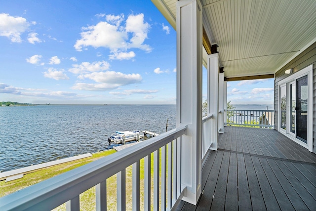 wooden deck featuring a water view