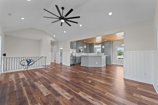 unfurnished living room with lofted ceiling, dark wood finished floors, visible vents, and recessed lighting