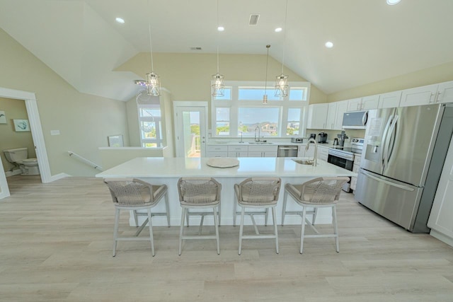 56738 NC-12 Hwy Lot 5, Hatteras, NC 27943 - kitchen featuring light countertops, appliances with stainless steel finishes, a spacious island, and a kitchen breakfast bar
