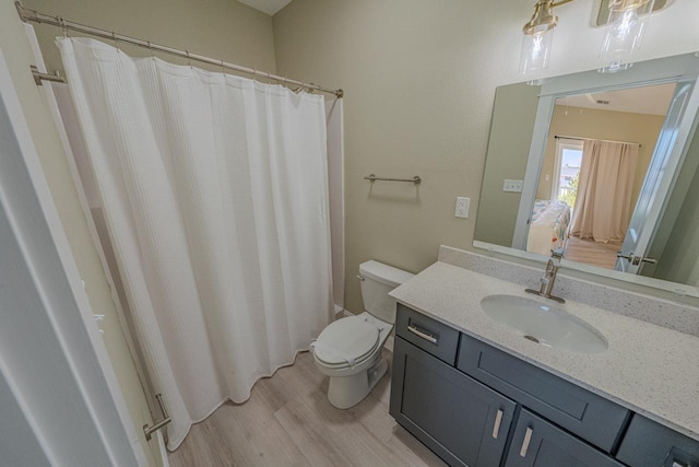 56738 NC-12 Hwy Lot 5, Hatteras, NC 27943 - ensuite bathroom with toilet, ensuite bathroom, wood finished floors, and vanity