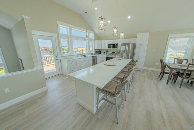 56738 NC-12 Hwy Lot 5, Hatteras, NC 27943 - kitchen with a sink, light wood-style floors, a healthy amount of sunlight, and appliances with stainless steel finishes