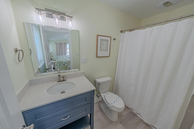 56738 NC-12 Hwy Lot 5, Hatteras, NC 27943 - ensuite bathroom with toilet, vanity, connected bathroom, and wood finished floors