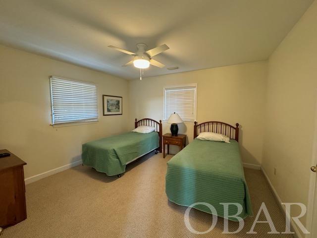 bedroom featuring carpet flooring, ceiling fan, and baseboards