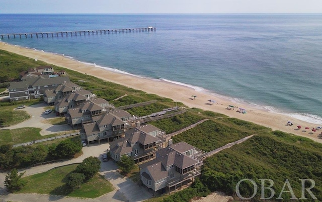 birds eye view of property with a water view, a residential view, and a view of the beach