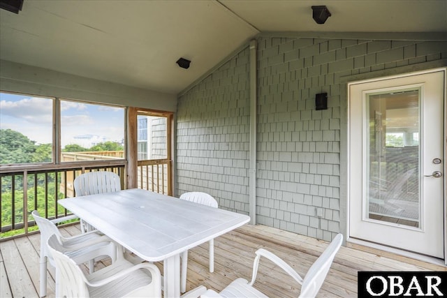 wooden deck featuring outdoor dining area