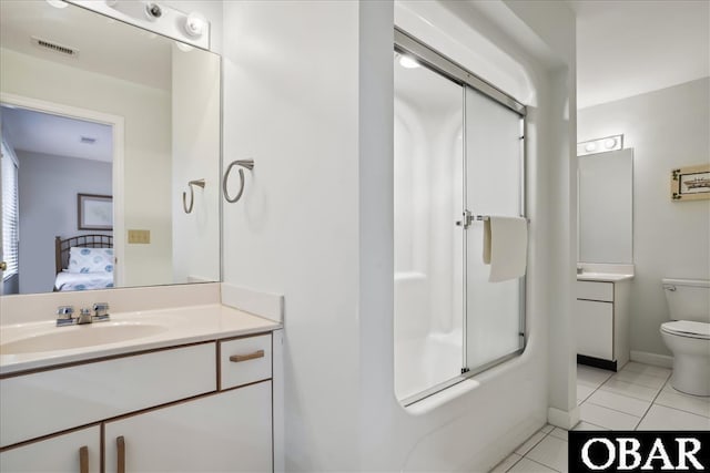 ensuite bathroom featuring toilet, visible vents, vanity, tile patterned floors, and ensuite bath