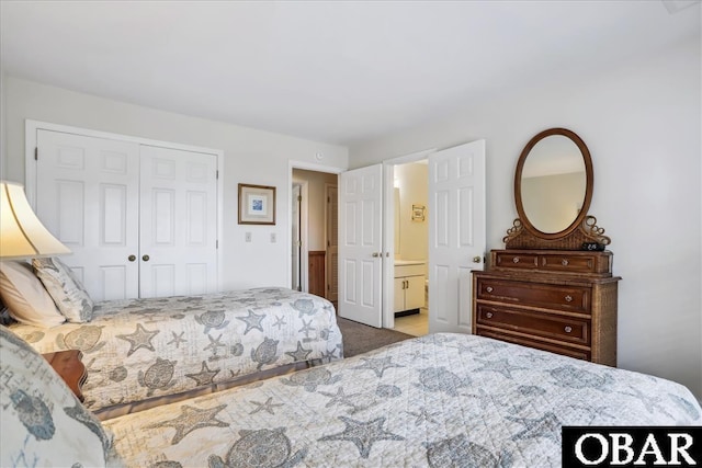 bedroom featuring a closet and light colored carpet