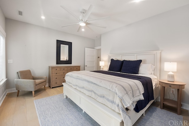 bedroom with light wood finished floors, visible vents, baseboards, a ceiling fan, and recessed lighting