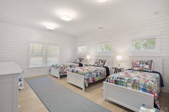 bedroom featuring light wood-style floors