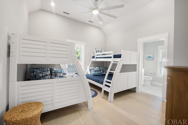 bedroom featuring visible vents, vaulted ceiling, and light wood finished floors