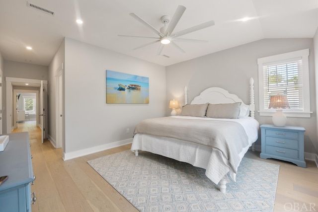 bedroom featuring light wood finished floors, multiple windows, and visible vents