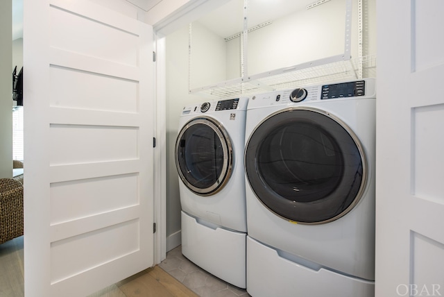 laundry area featuring laundry area and washing machine and dryer