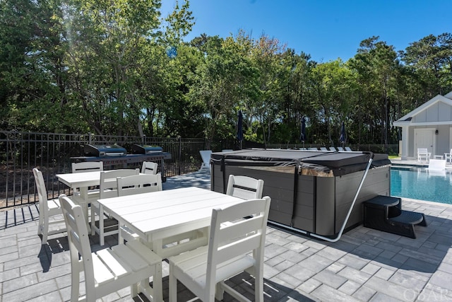 view of patio with a hot tub, a fenced in pool, a grill, fence, and outdoor dining area