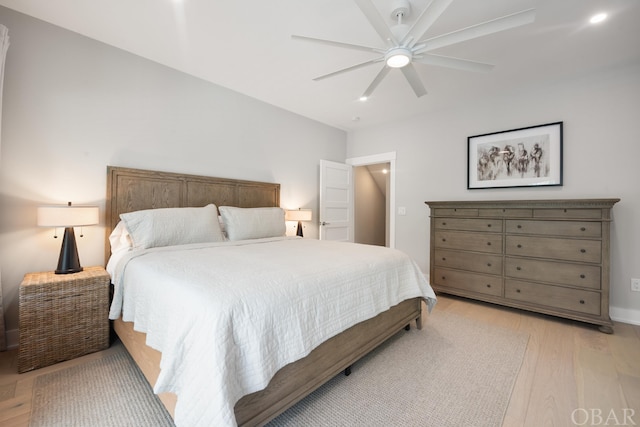 bedroom featuring a ceiling fan and light wood finished floors