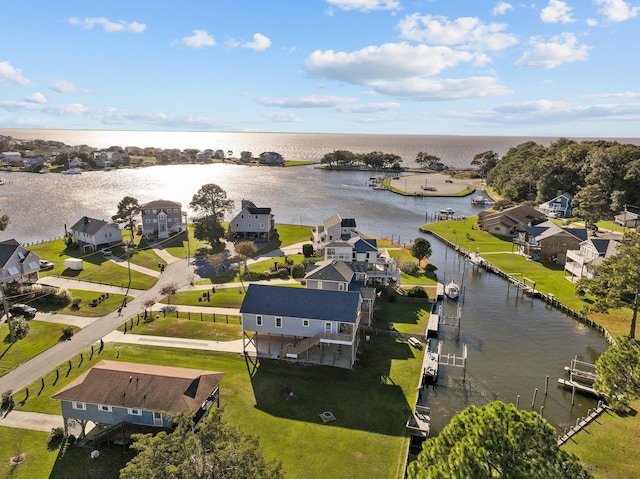 drone / aerial view with a residential view and a water view