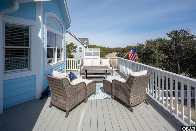 wooden deck featuring an outdoor hangout area