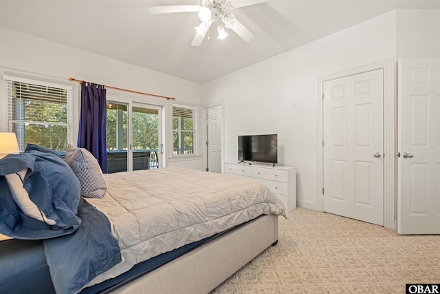 bedroom featuring a ceiling fan, access to outside, and light colored carpet