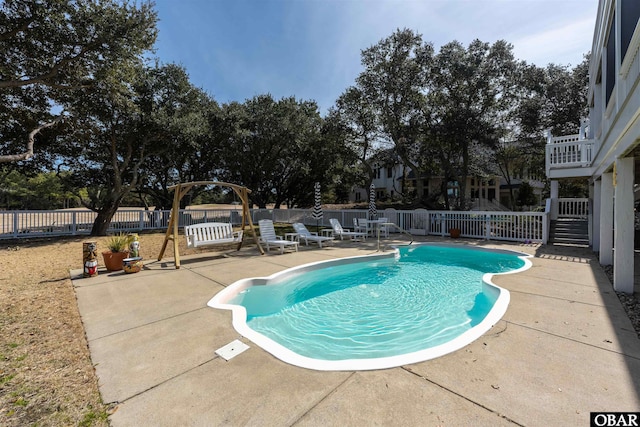 view of swimming pool with a patio, a fenced backyard, and a fenced in pool