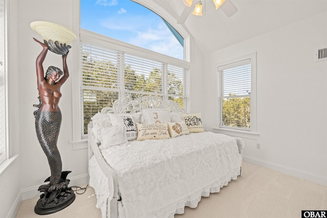 bedroom featuring baseboards, carpet, and lofted ceiling