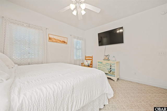 bedroom featuring carpet flooring, a ceiling fan, and baseboards