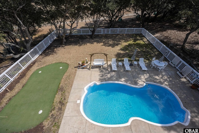 view of swimming pool with a patio area, a fenced in pool, and a fenced backyard