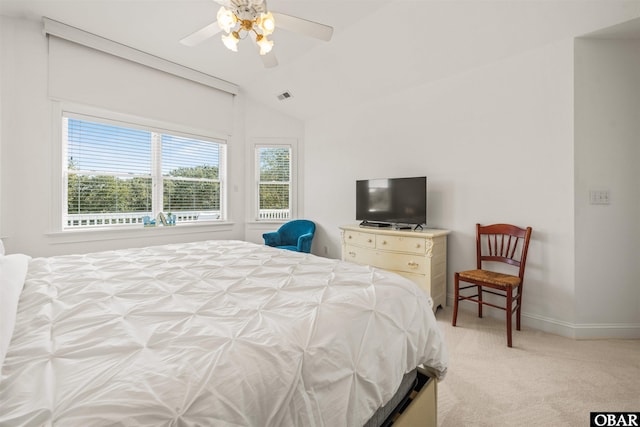 bedroom featuring visible vents, baseboards, light colored carpet, vaulted ceiling, and a ceiling fan