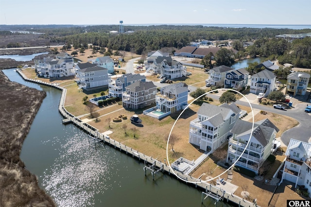 aerial view with a water view and a residential view