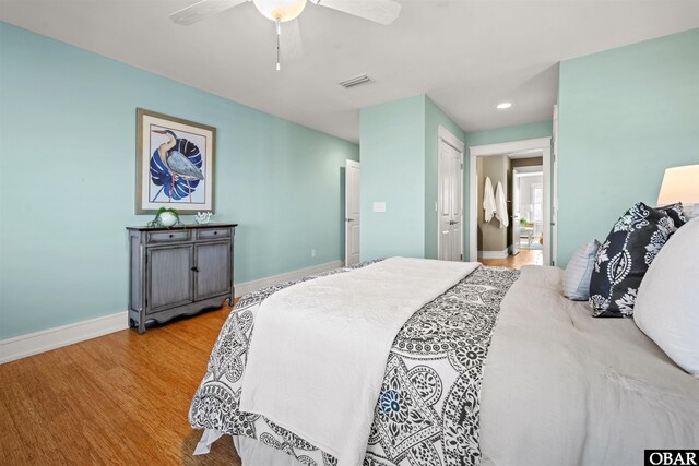 bedroom with visible vents, ceiling fan, baseboards, recessed lighting, and wood finished floors