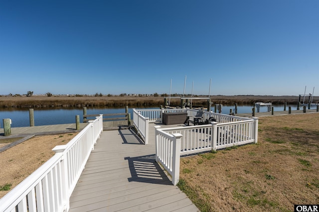 dock area featuring a water view