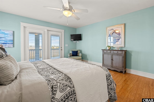 bedroom with baseboards, light wood-style floors, access to exterior, and a ceiling fan