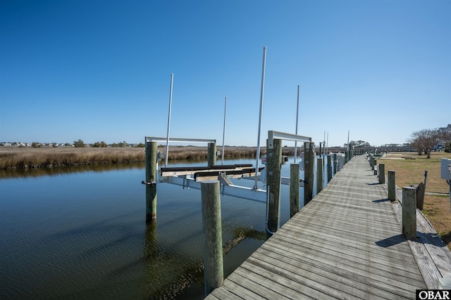 view of dock with a water view and boat lift