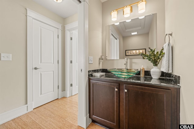 interior space featuring a sink and light wood finished floors