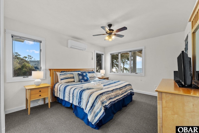 bedroom featuring dark colored carpet, a wall mounted air conditioner, baseboards, and multiple windows