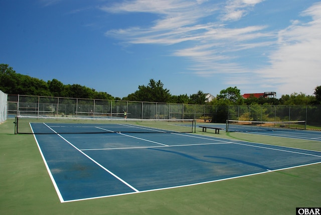 view of sport court with fence