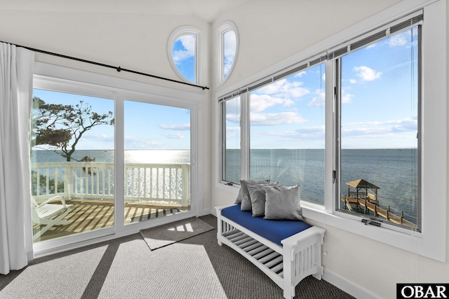 sunroom / solarium with a water view