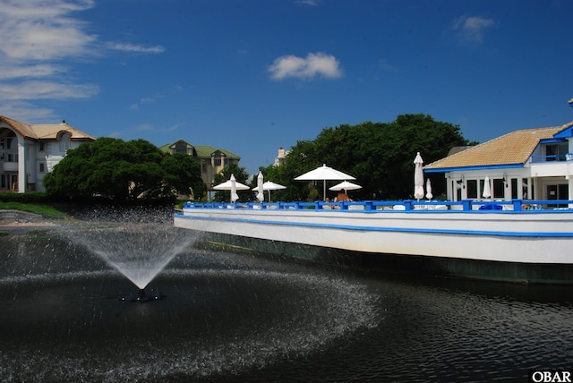 view of swimming pool featuring a water view