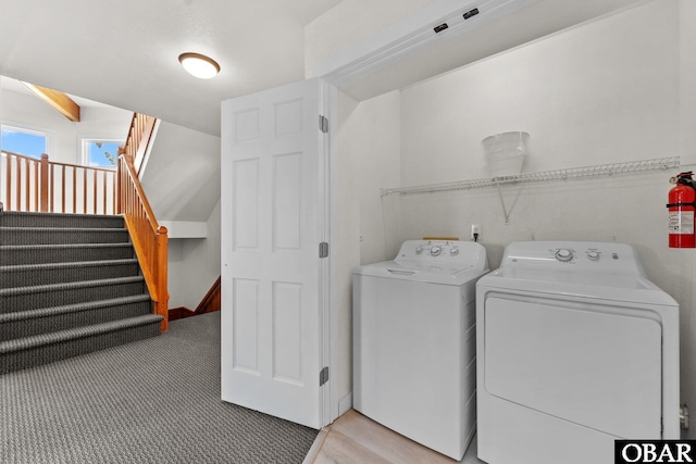 laundry area featuring carpet, laundry area, and separate washer and dryer