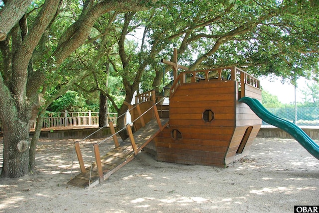 view of jungle gym with fence