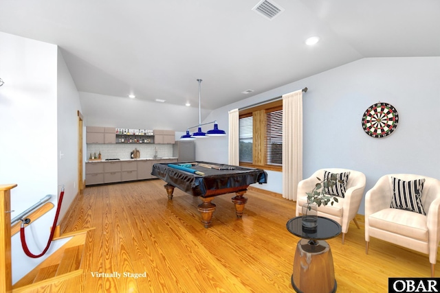 recreation room with visible vents, vaulted ceiling, a sink, light wood-type flooring, and billiards