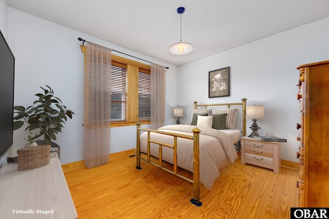 bedroom with light wood finished floors