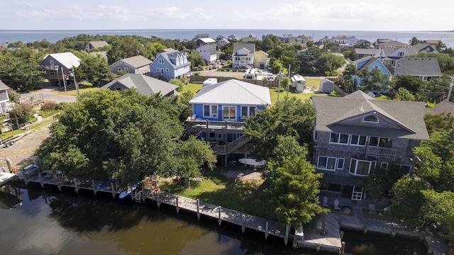 aerial view featuring a water view and a residential view