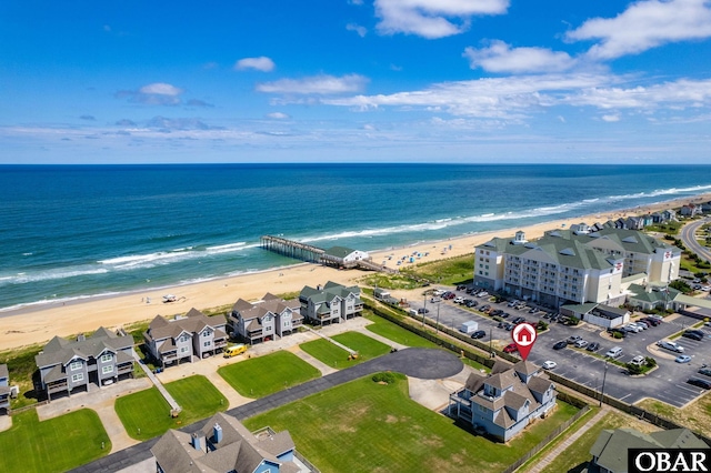 bird's eye view with a water view and a view of the beach