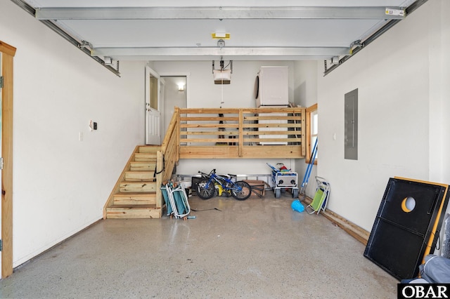 garage featuring electric panel and a garage door opener