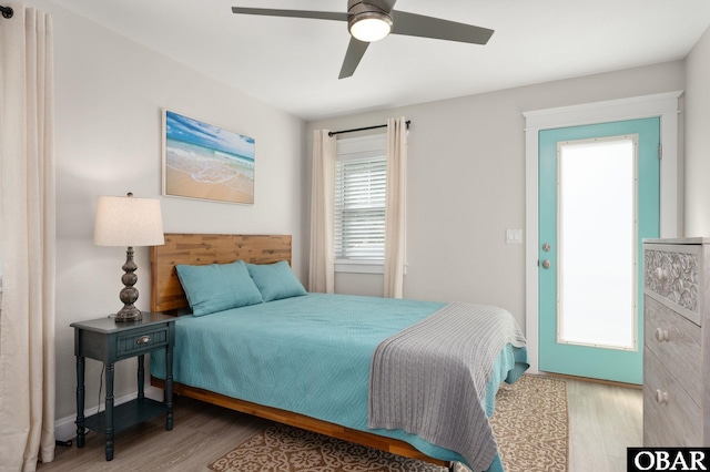 bedroom featuring a ceiling fan and wood finished floors