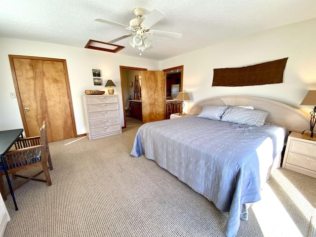 26823 Colony Dr Lot 41, Salvo, NC 27972 - bedroom featuring carpet flooring, a textured ceiling, a ceiling fan, and ensuite bath
