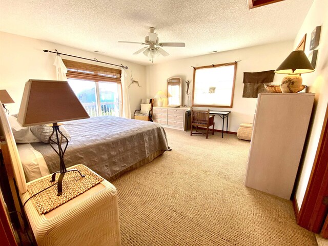 26823 Colony Dr Lot 41, Salvo, NC 27972 - bedroom with carpet flooring, a textured ceiling, and a ceiling fan