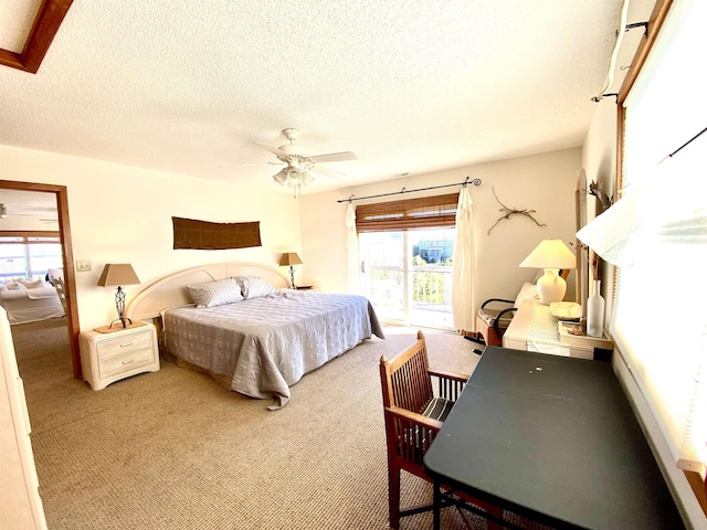 26823 Colony Dr Lot 41, Salvo, NC 27972 - bedroom featuring carpet flooring, a textured ceiling, access to outside, and a ceiling fan