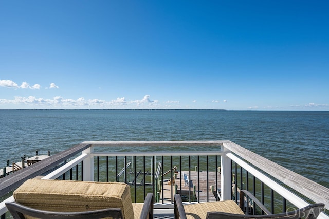 balcony featuring a water view