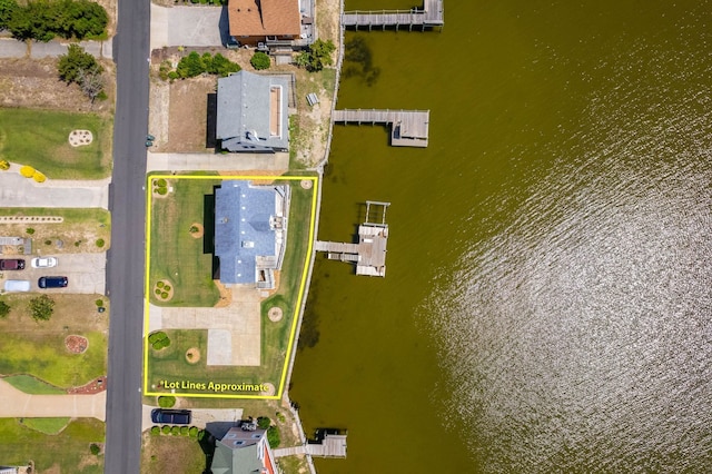 birds eye view of property featuring a water view